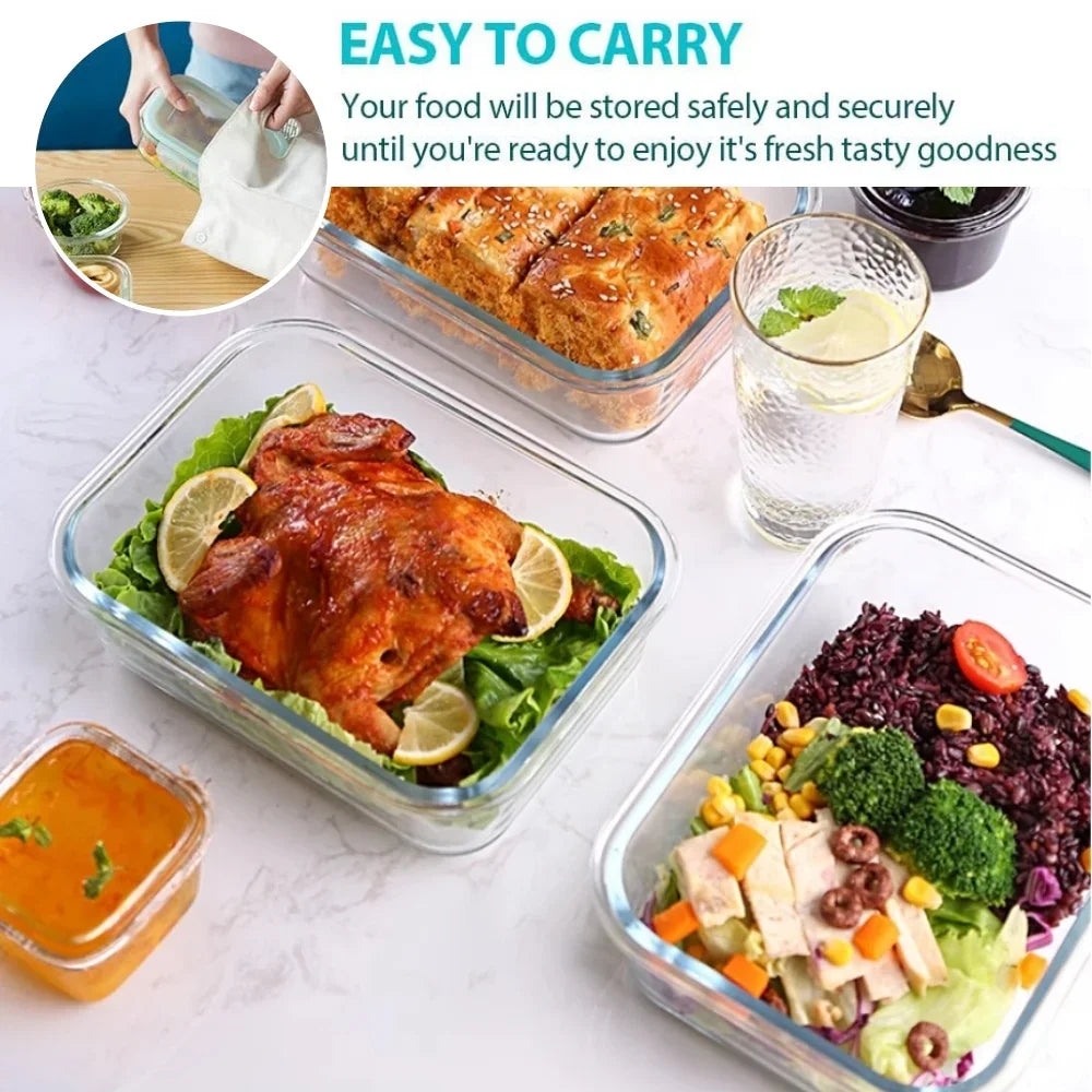 Glass food containers with meals inside, including a roasted chicken and a salad, on a white surface.