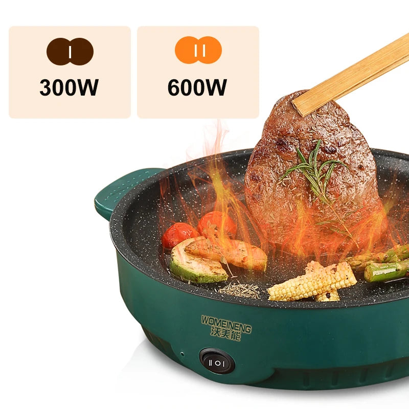 Green electric hot pot with food being cooked, featuring power ratings and WOIMEINENG branding.