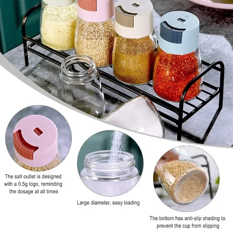 Set of spice jars with a black metal rack on a kitchen counter.