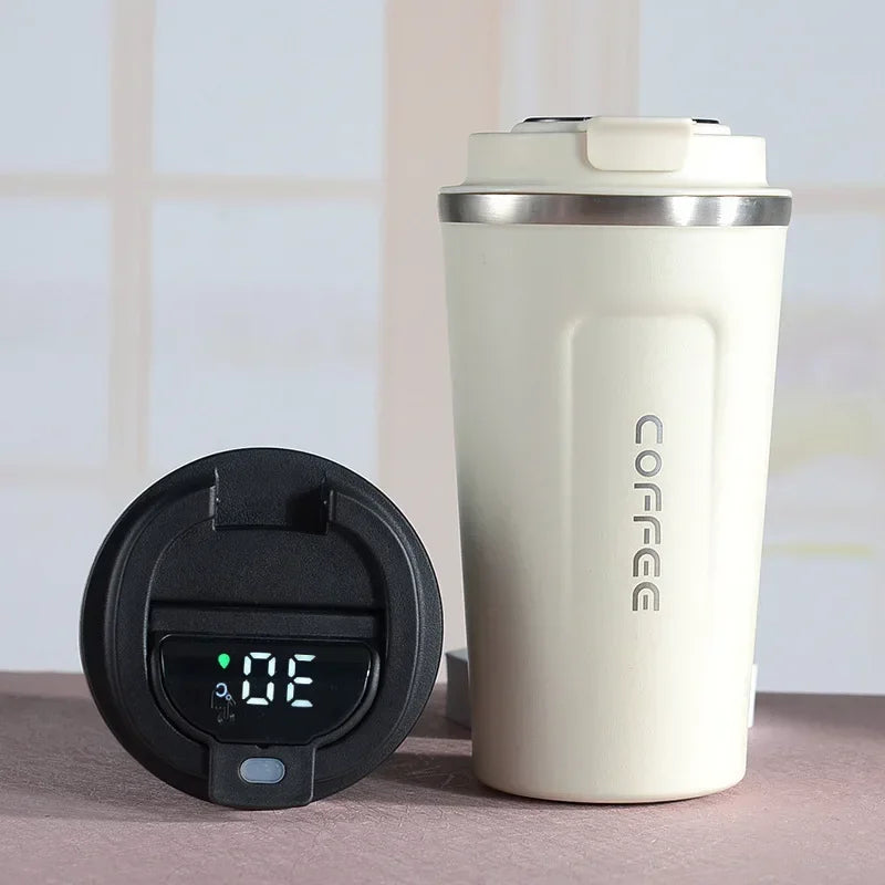 White insulated coffee tumbler with 'COFFEE' text and a black digital timer on a neutral background