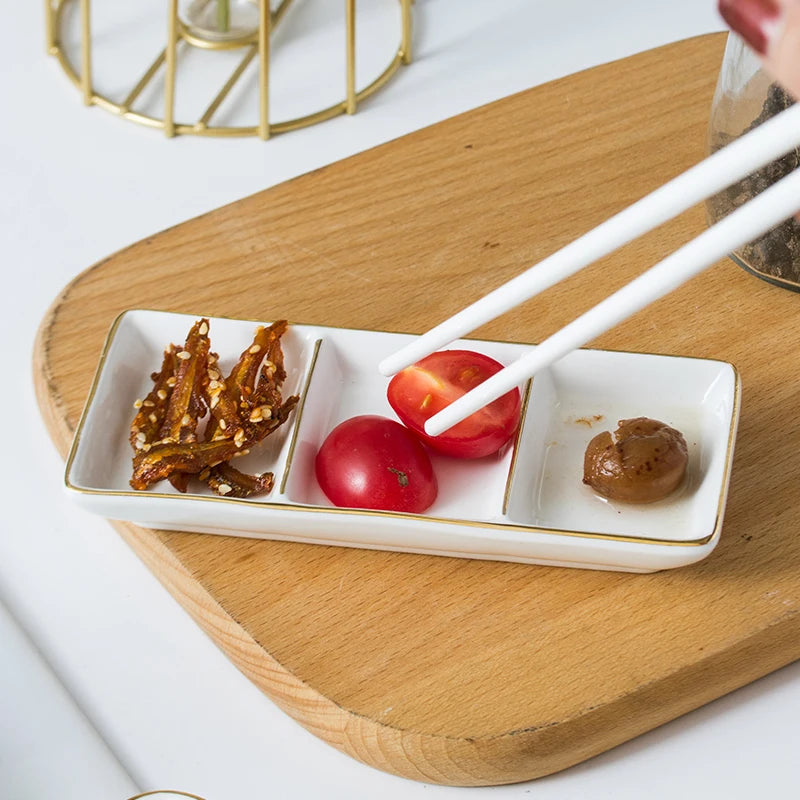 White ceramic tray with food items on a wooden board